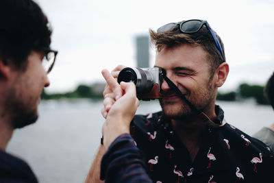 Portrait of man photographing