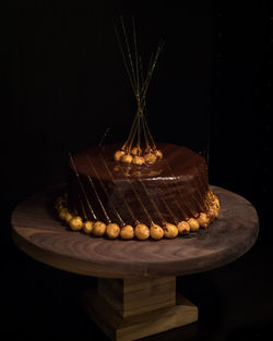 Close-up of cake against black background