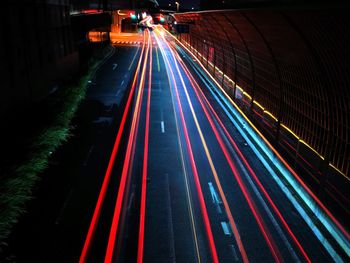 High angle view of light trails on road at night