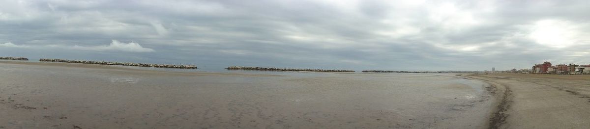 Scenic view of beach against sky