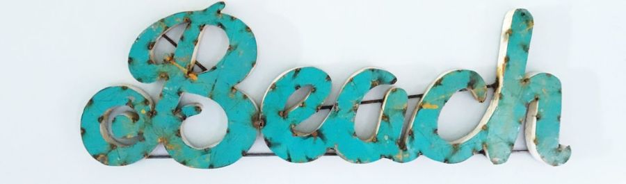 Close-up of colored pencils over white background