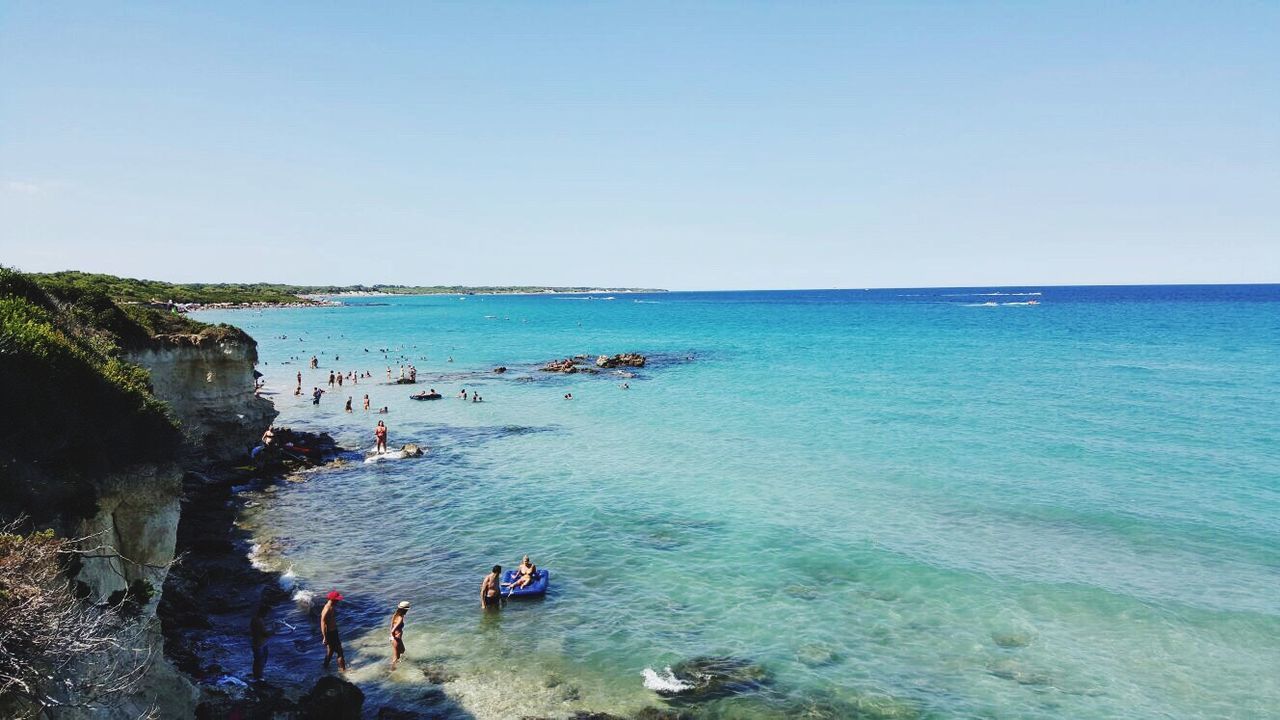 HIGH ANGLE VIEW OF PEOPLE ON BEACH