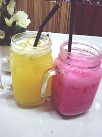 Close-up of drink in glass jar on table