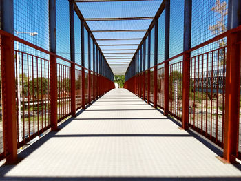 Footbridge against clear sky