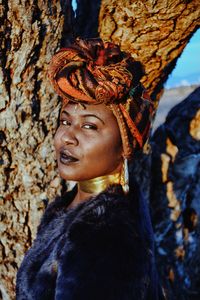 Close-up portrait of female model wearing traditional clothing by tree