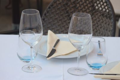 Close-up of wine glasses on table