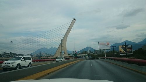 Cars on highway against sky