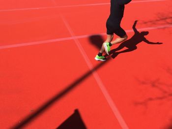 Close-up of woman relaxing on wall
