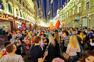People on street in city at night
