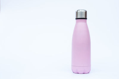 Close-up of bottle against white background