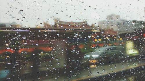 Rain drops on glass window of rainy season