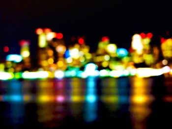 Defocused image of illuminated city at night