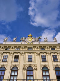 Low angle view of building against cloudy sky