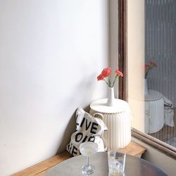 Flower vase on table at home