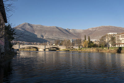 Bridge over river against clear sky