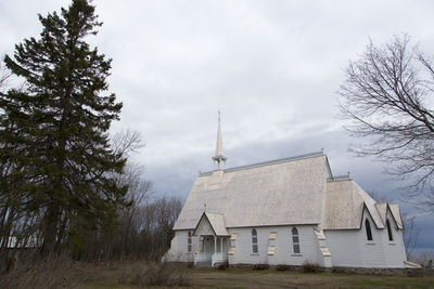 Side view of pretty 1865 patrimonial wooden anglican st. james the apostle church 