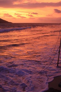 Scenic view of sea against dramatic sky