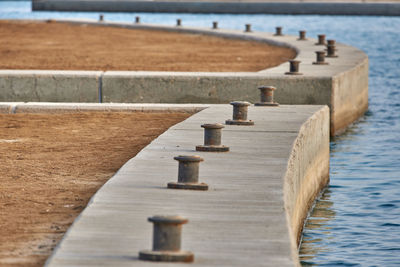 Close-up of cleats on pier