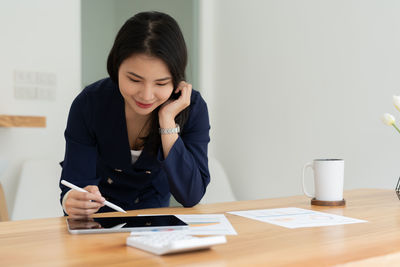 Businesswoman working on table