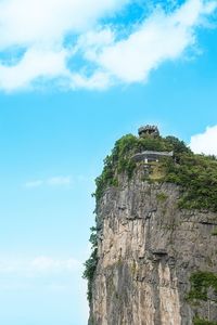 Low angle view of rock formation against sky