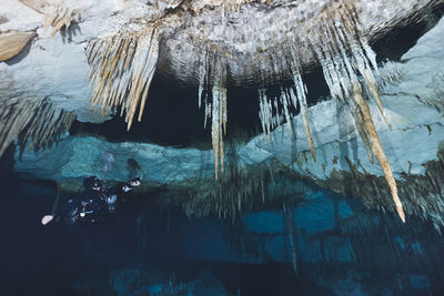 Low angle view of icicles on rock