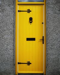 Close-up of yellow door