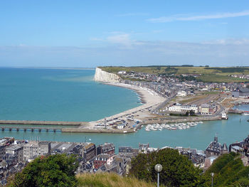 High angle view of sea and buildings against sky