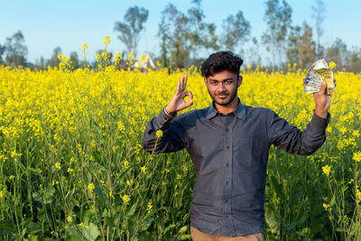 Full length of a man standing in field