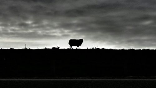 View of landscape against cloudy sky