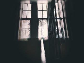 Sunlight streaming through window in abandoned house