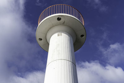 Low angle view of tower against cloudy sky