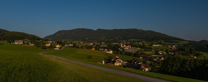 Panoramic view of landscape and buildings against clear sky