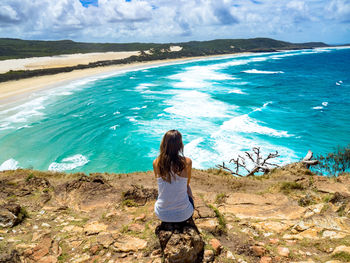 Rear view of woman looking at sea