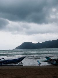 Scenic view of sea against cloudy sky