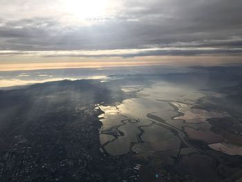 Aerial view of landscape against sky during sunset