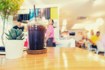 Close-up of coffee served on table at cafe