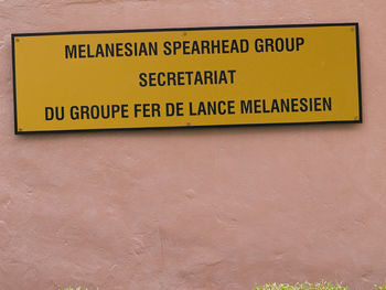 Close-up of sign board on wall