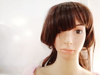 Close-up of mannequin against white background