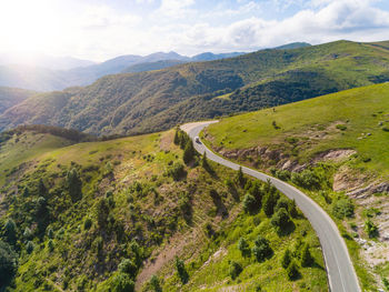 High angle view of road amidst mountains against sky