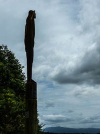 Low angle view of statue against sky