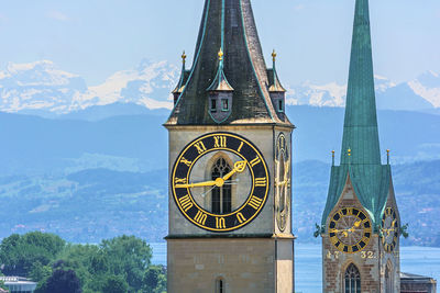 Clock towers in city against sky