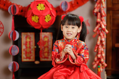 Portrait of a smiling girl in traditional clothing