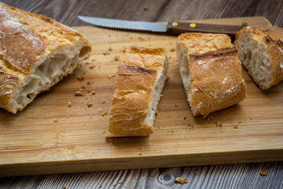 High angle view of bread on cutting board