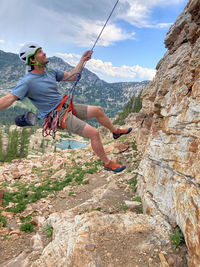 Rock climbing man having fun