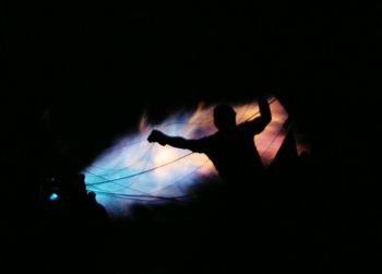 Silhouette man against sky at night