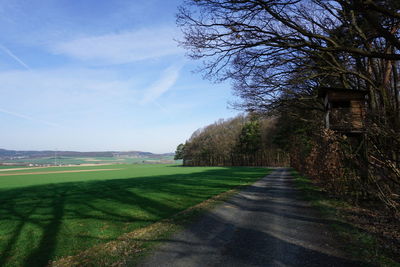 Scenic view of farm against sky