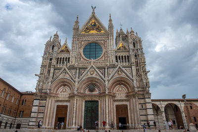 Facade of siena dome, italy, historic building against sky