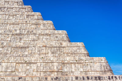 Low angle view of temple against blue sky