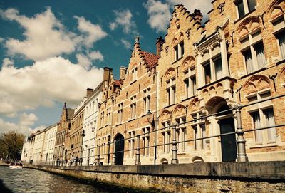 Low angle view of historical building against cloudy sky