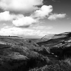 Scenic view of landscape against cloudy sky